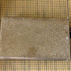 House of Harlow 1960 Golden Rhinestones covered clutch.